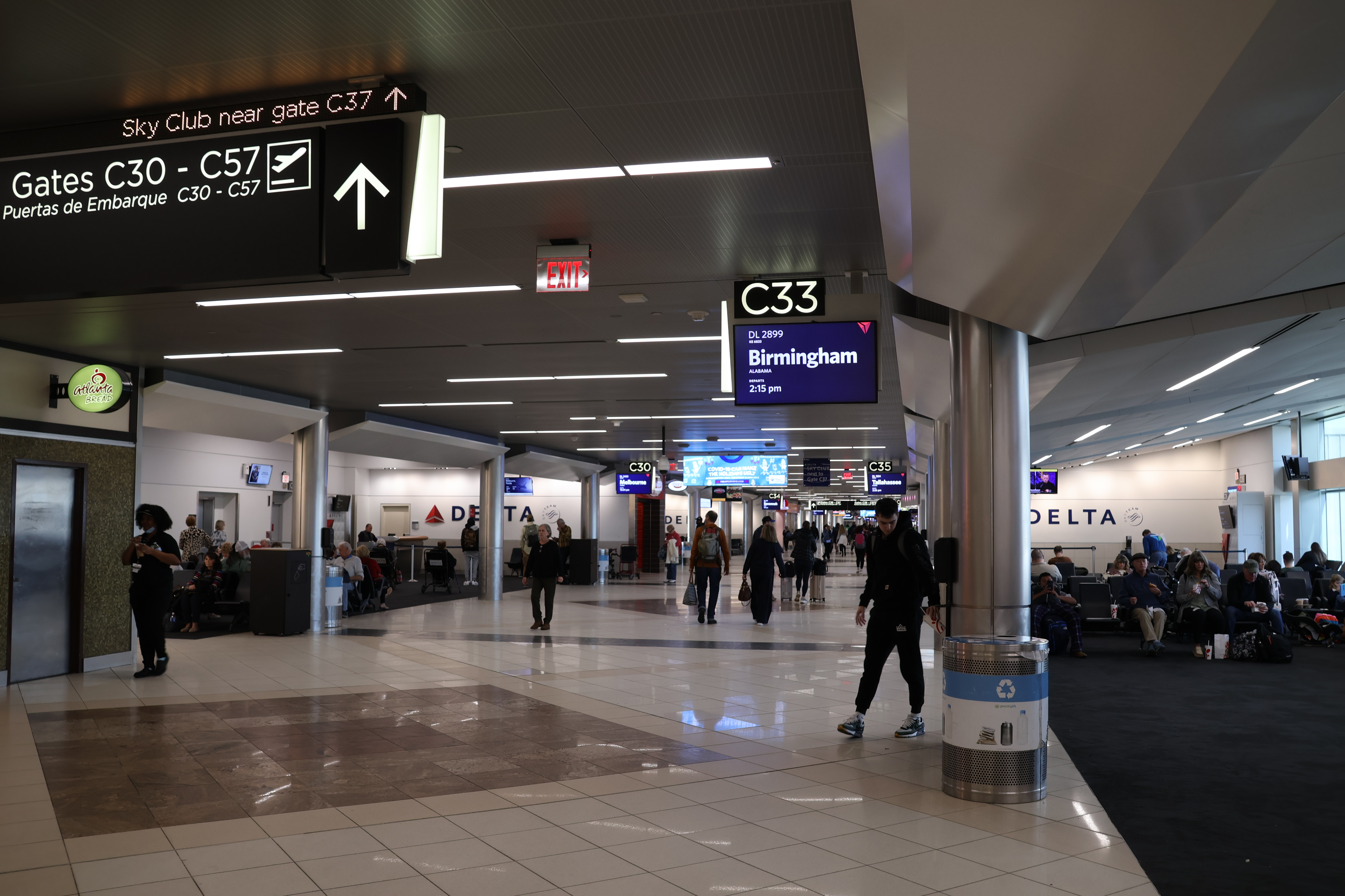 Interior photograph of Concourse C at gate C33 in December 2023, showing the gate area, seating and concourse signage