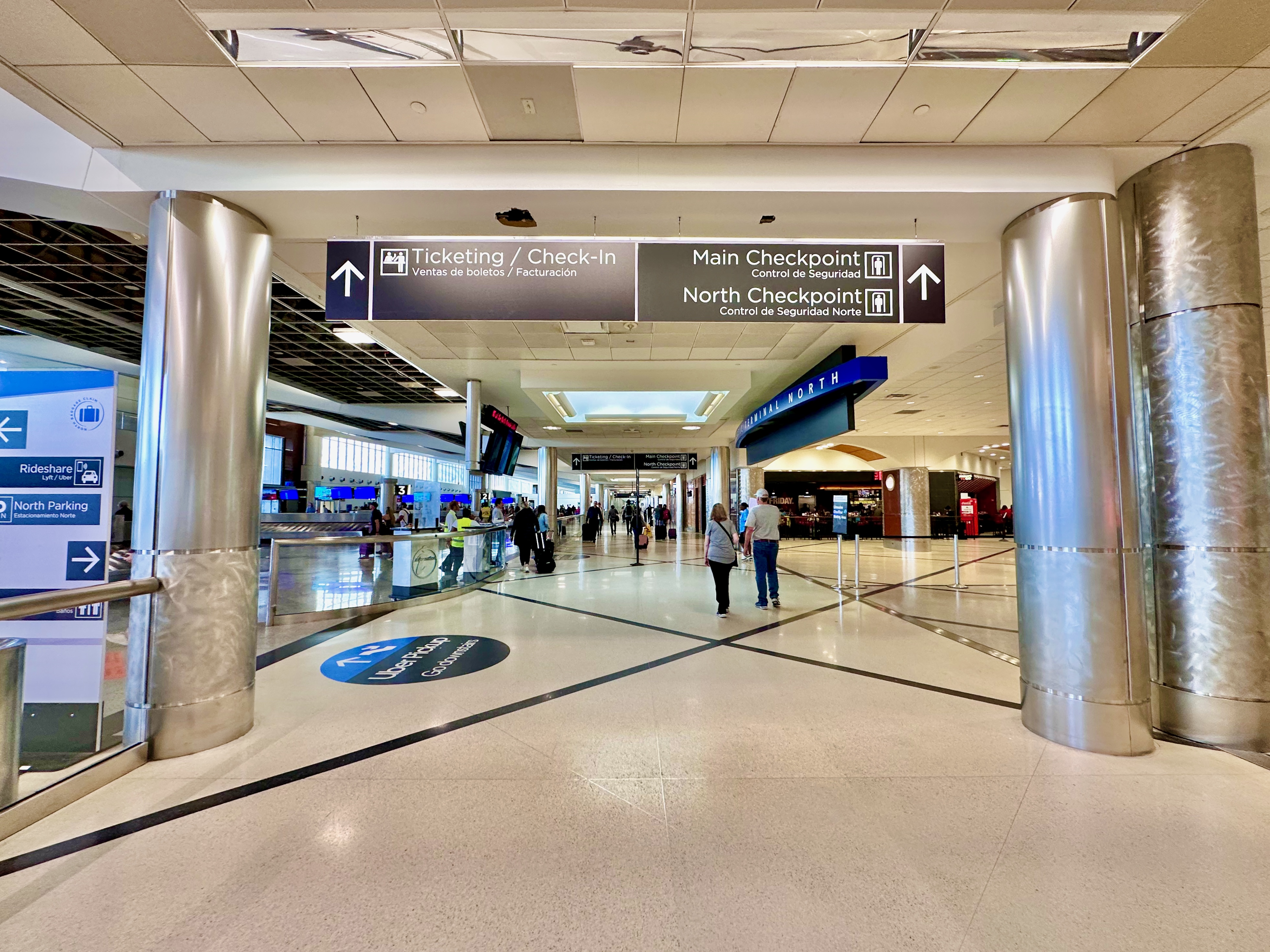 Interior photograph of the Domestic Terminal ticketing and check-in hall at Hartsfield-Jackson in May 2023, with overhead signage for the Main and North Checkpoints and check-in counters below